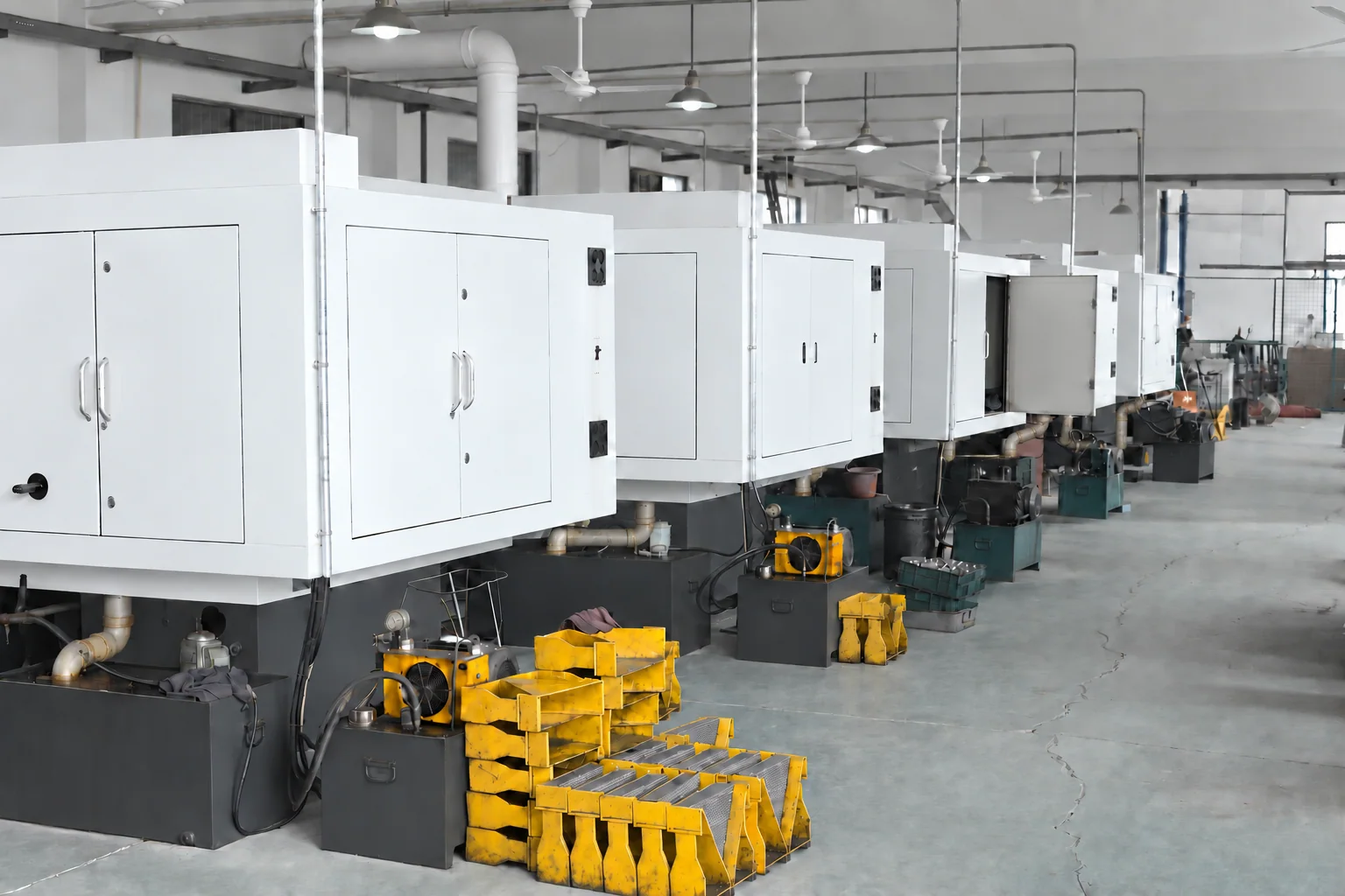 Rows of enclosed production machines at Eazor Tools